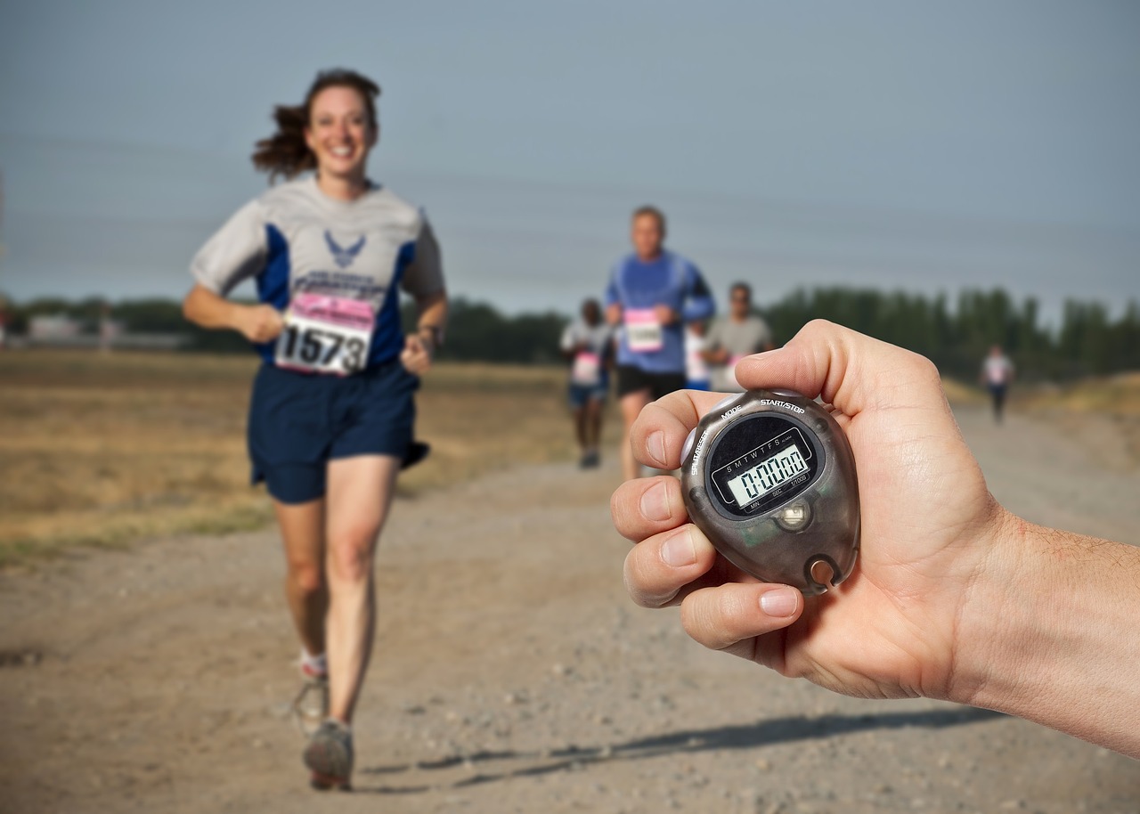 race runner running time chronometer competition marathon woman man hand timing measure endurance athlete gap advantage marathon marathon marathon marathon marathon advantage advantage