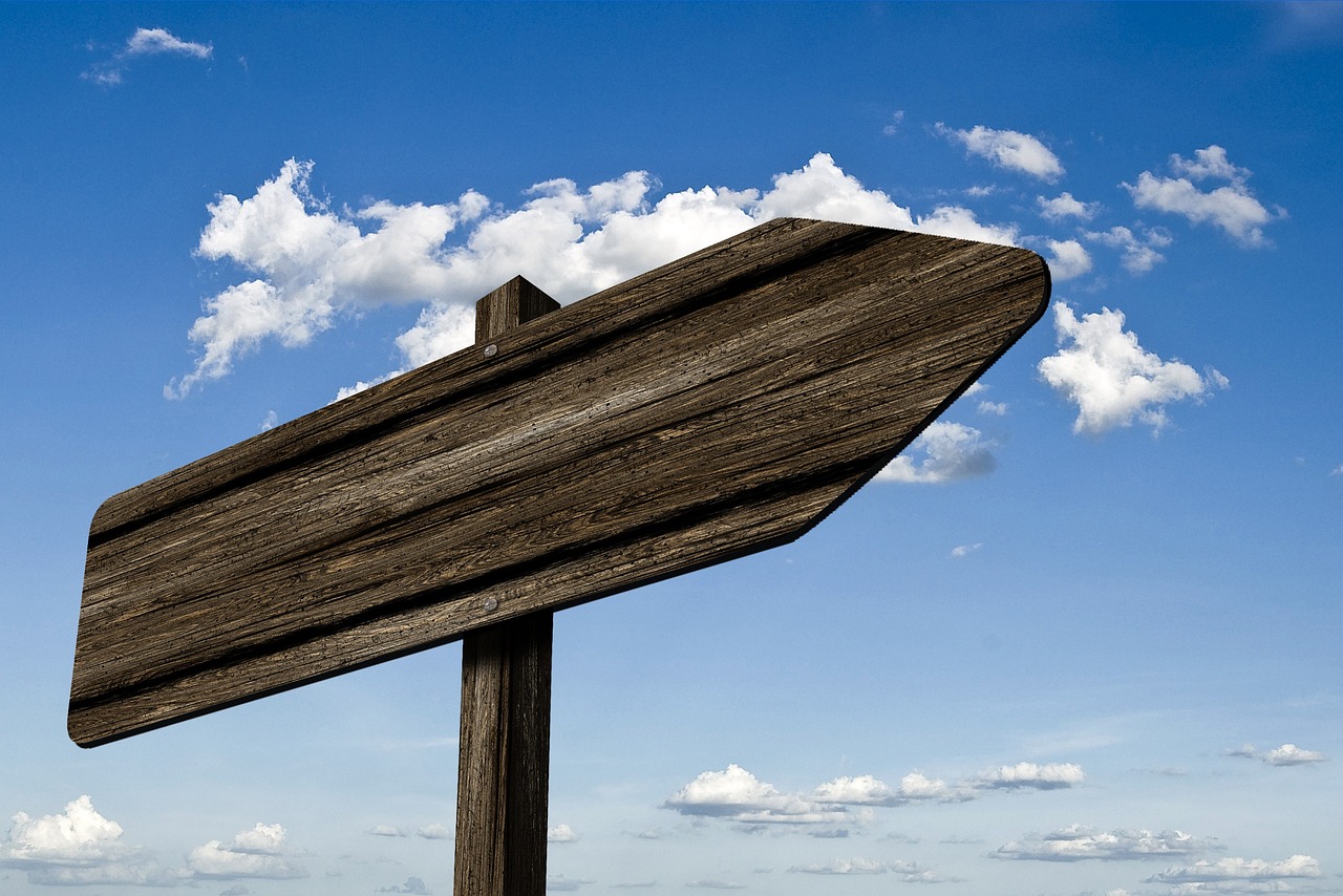 signpost nature waypoint wood grain board sign direction right path marking arrow heaven clouds