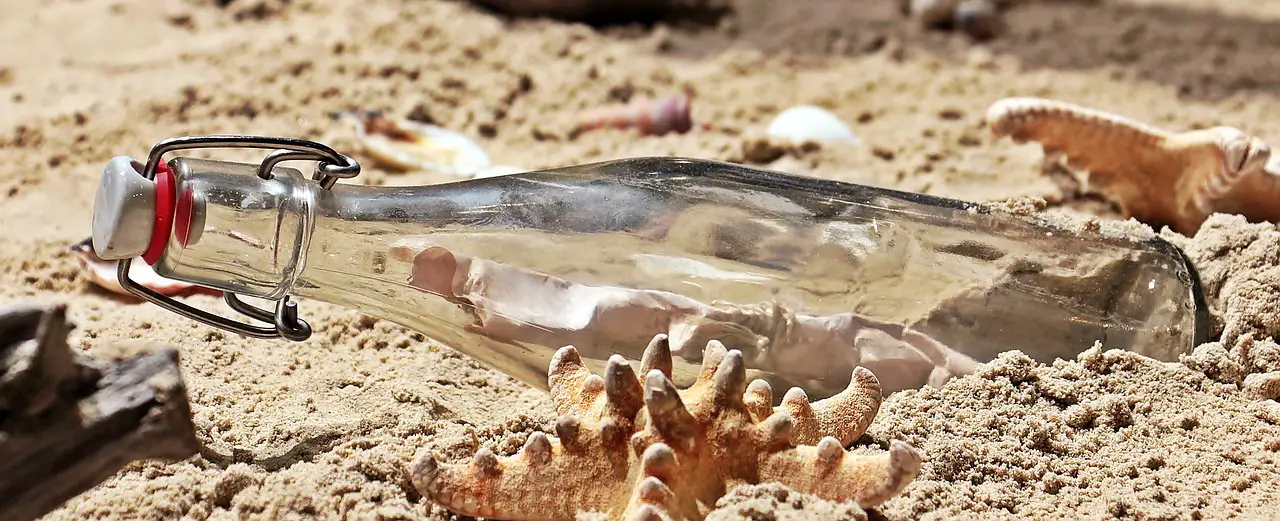 bottle message beach message in a bottle sand nature glass bottle starfish flotsam coast seashore