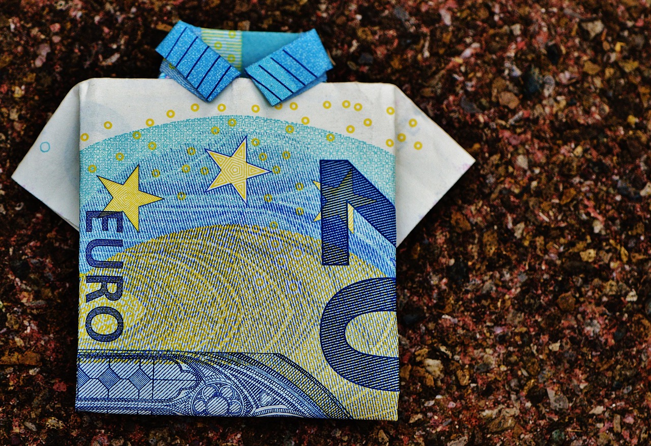 folded dollar bill and currency